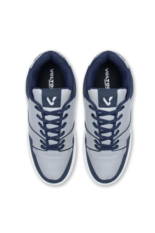 Pair of gray sneakers with navy accents on a white background