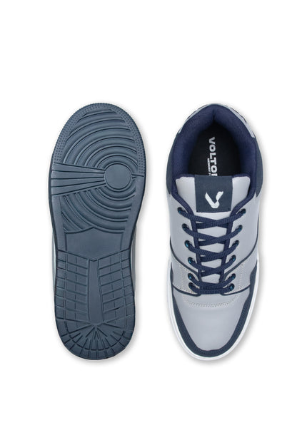 Gray and navy blue sneaker with brand logo on a white background
