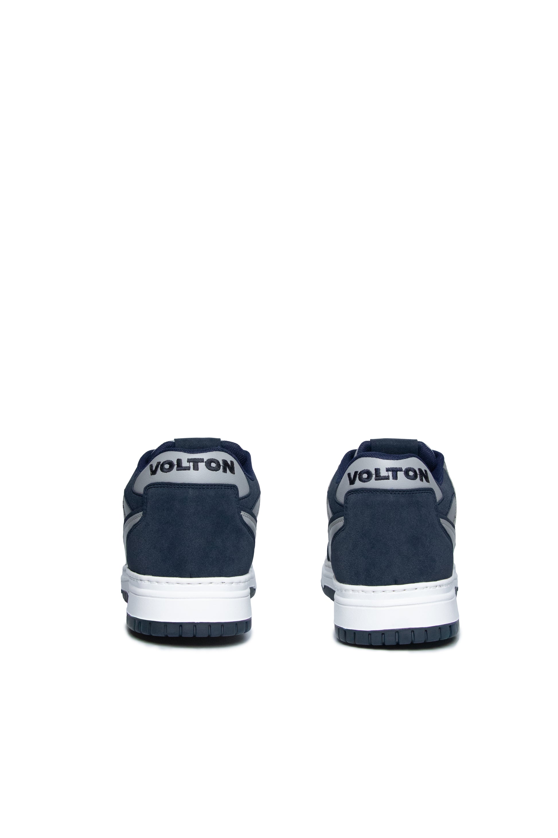 Navy blue Volton sneakers with white soles on a white background
