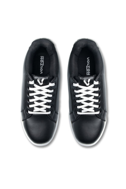 Black sneakers with white laces on a white background