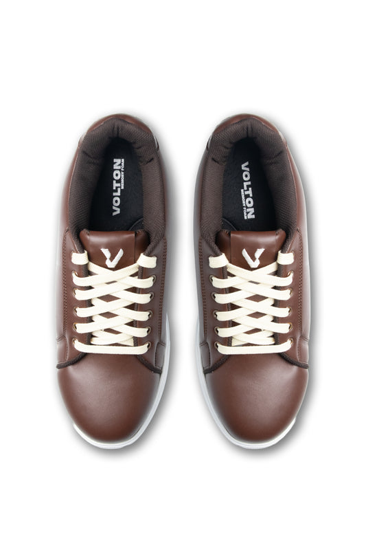 Brown sneakers with white laces on a white background